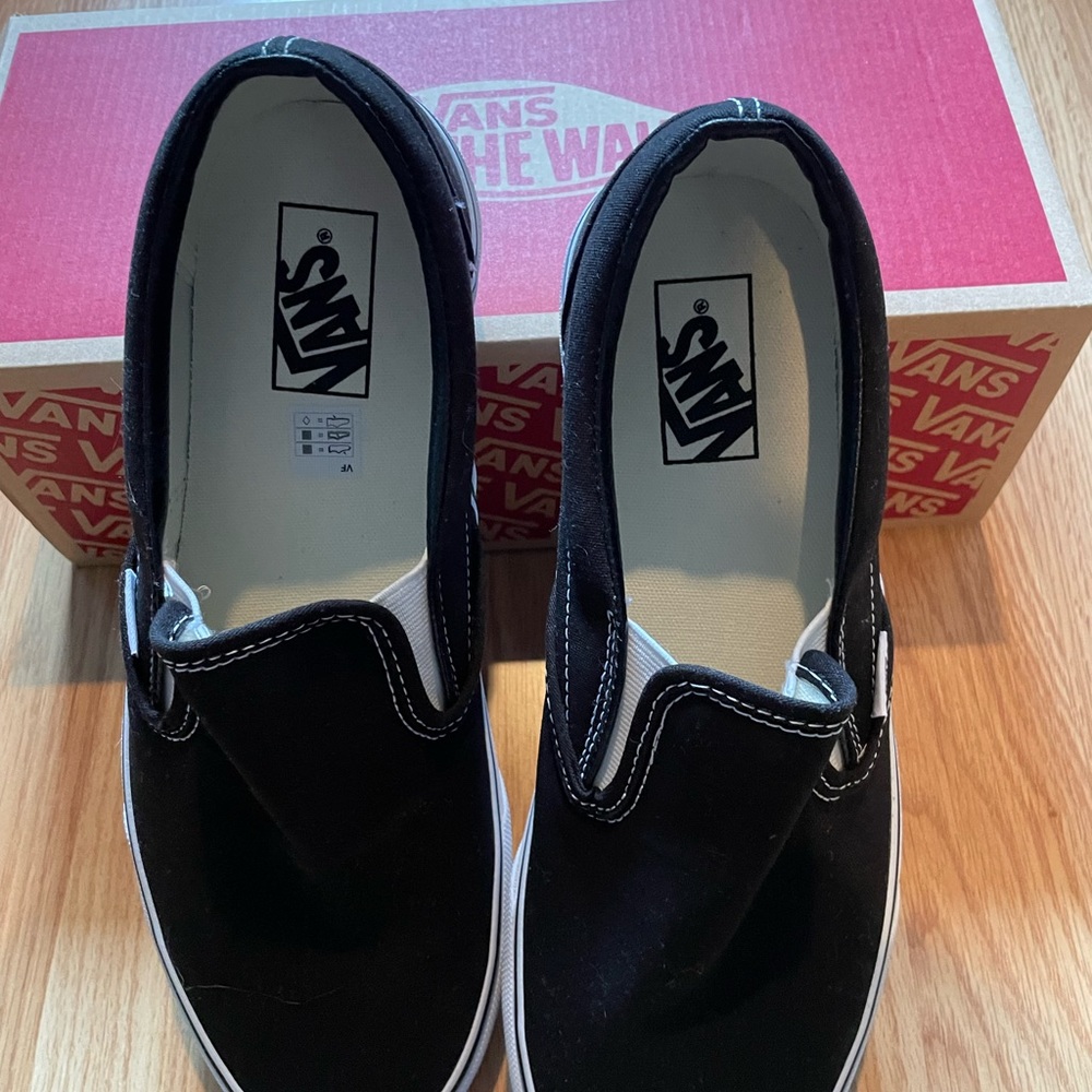 Vans in black. Size 10. Never worn. New in box.